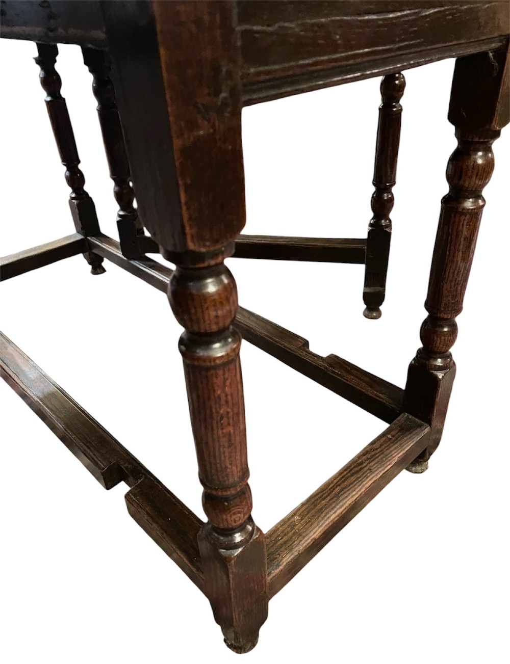 An 18th-century walnut gateleg table featuring an oval drop-leaf top supported by turned legs. View VII