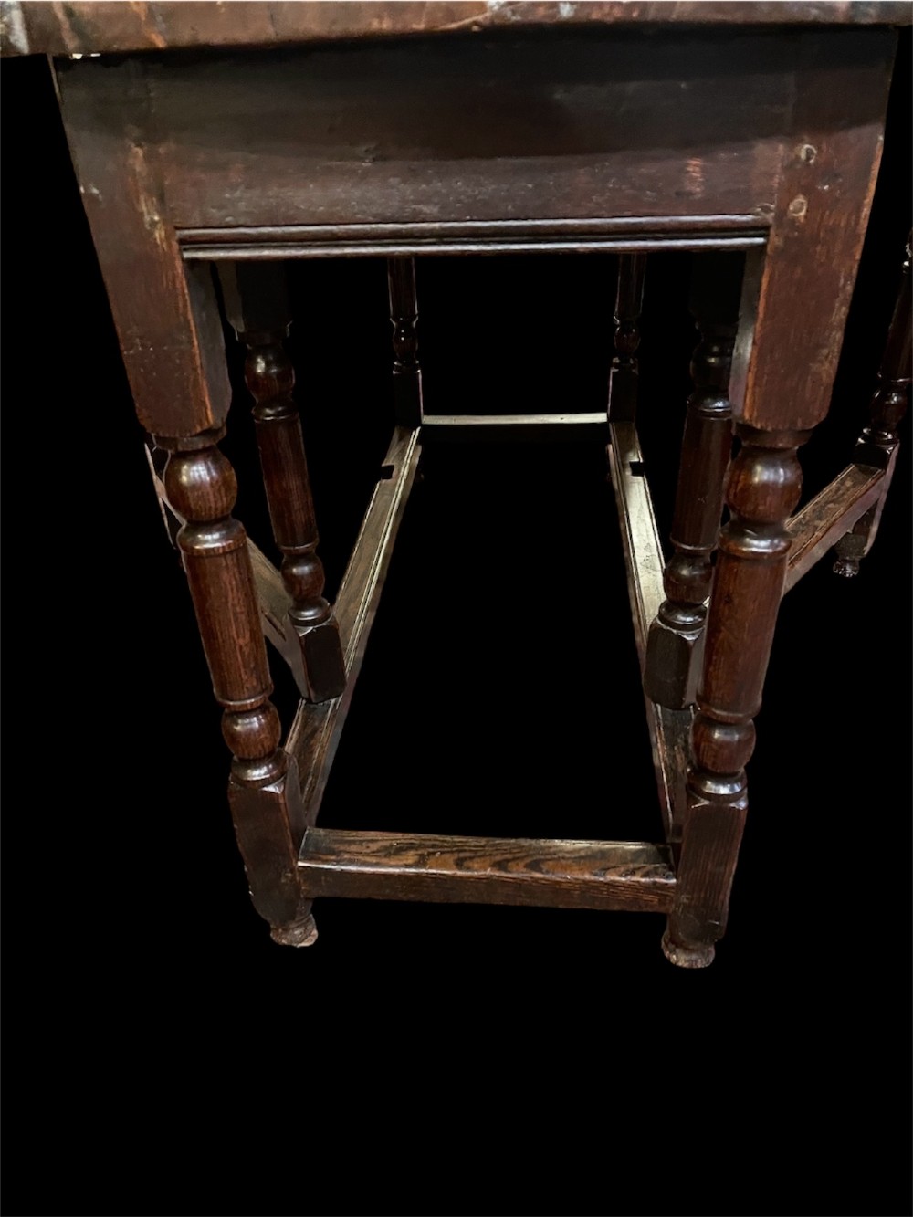 An 18th-century walnut gateleg table featuring an oval drop-leaf top supported by turned legs. View XI