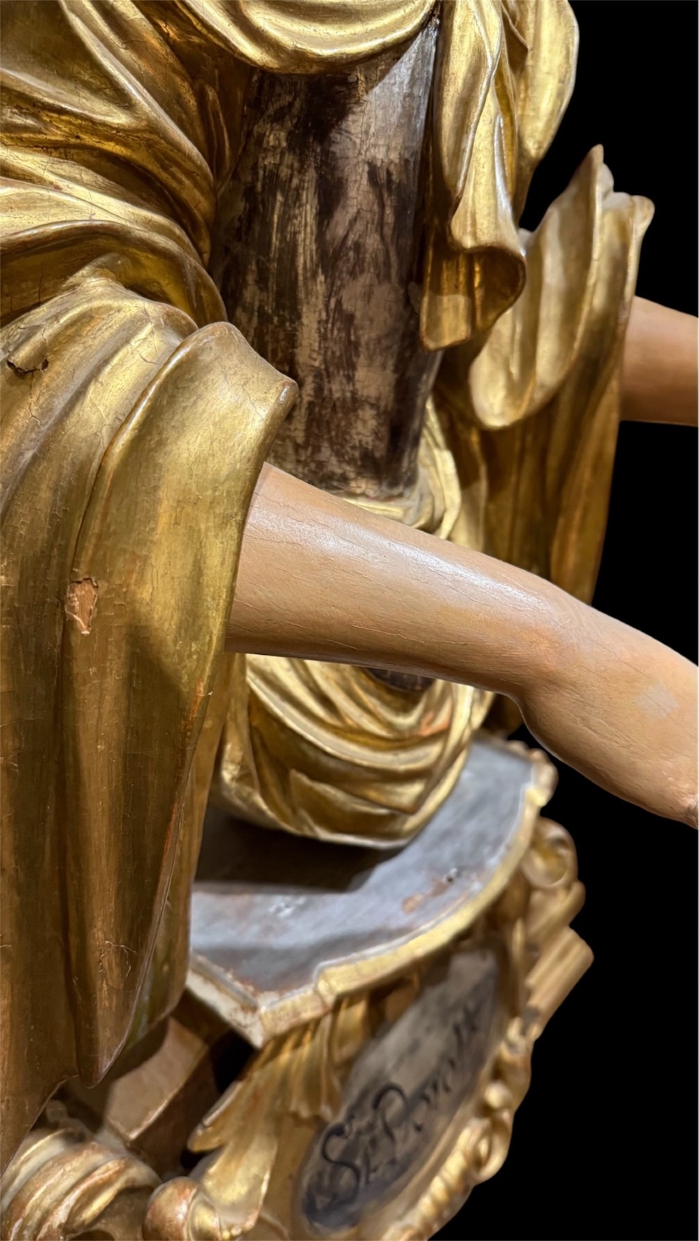 A seventeenth-century carved wooden bust of Saint Dorothea featuring gilded drapery and polychrome painted skin tones mounted on a decorative cartouche base. View IX