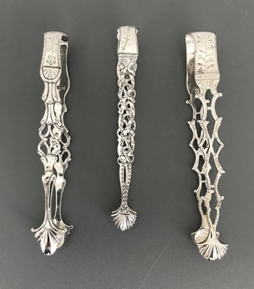 Three Georgian Cast Silver Sugar Tongs