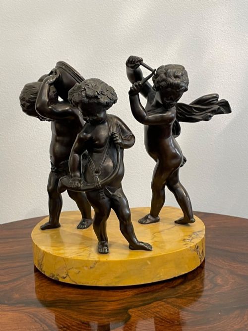 After Claude Michel Clodion (French, 1738 - 1814), a Bronze Figural Group of Musical Putti