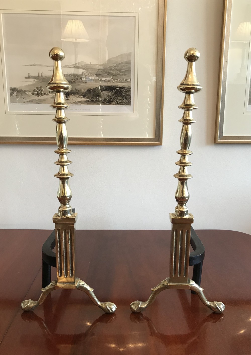 A pair early 20th Century brass dog irons