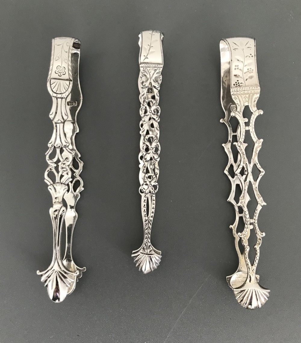 Three Georgian Cast Silver Sugar Tongs