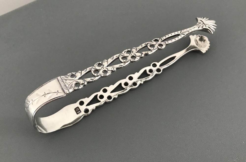 Three Georgian Cast Silver Sugar Tongs View V