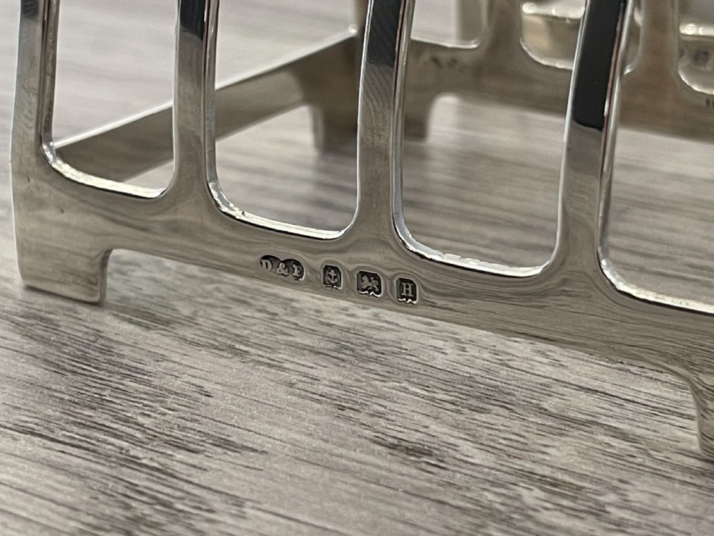 A Boxed Set of Four George V Solid Silver Toast Racks  View V