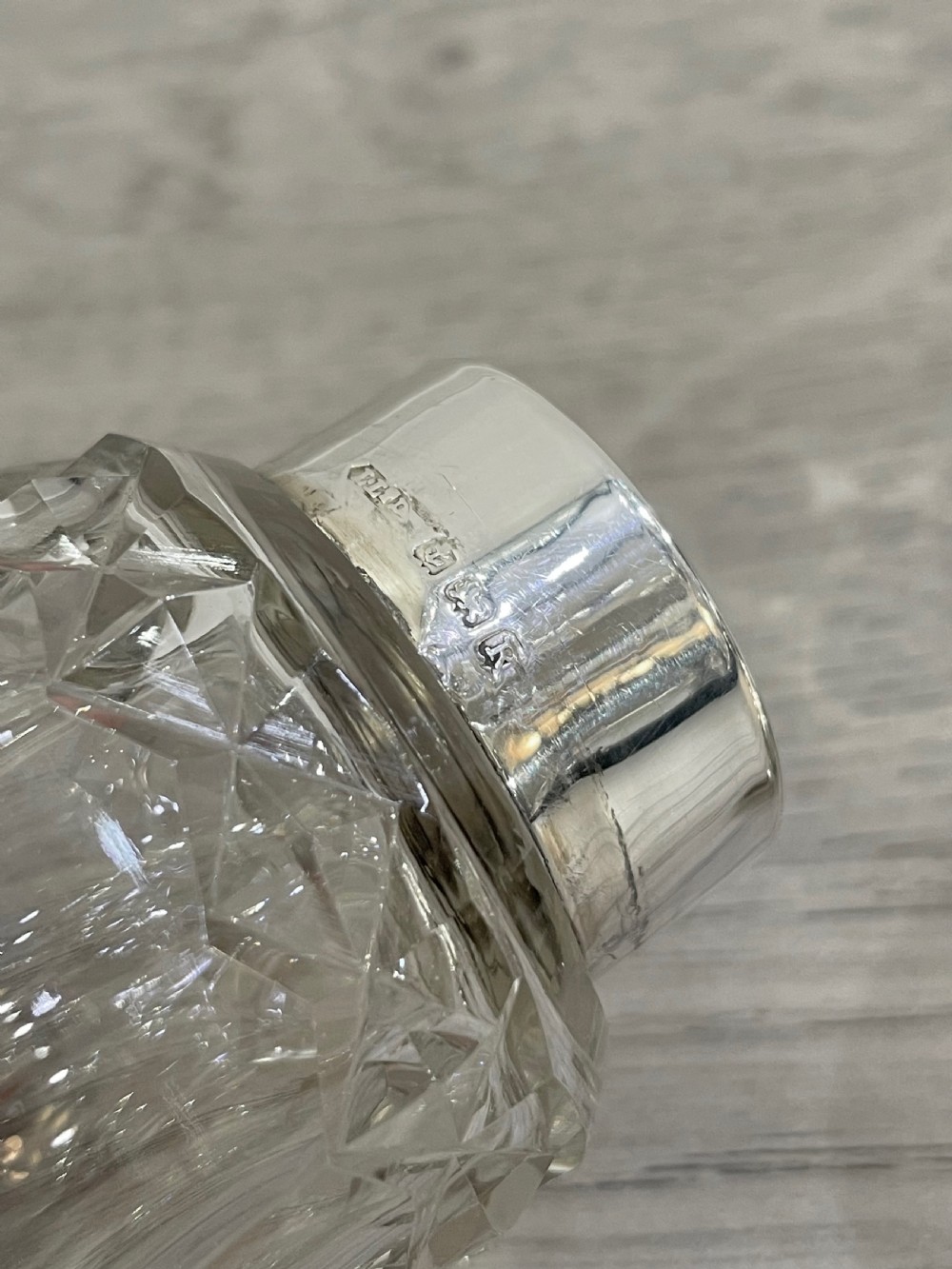 Pretty George VI cut glass and silver sugar caster  View VI