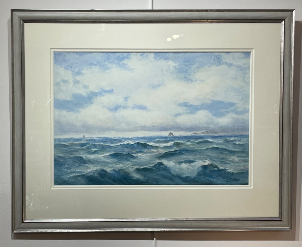 A framed watercolour painting depicting choppy blue ocean waves with distant sailing vessels under a cloudy sky.