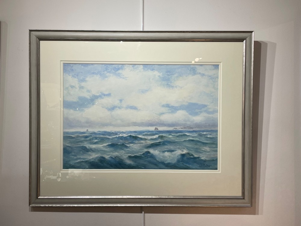 A framed watercolour painting depicting choppy blue ocean waves with distant sailing vessels under a cloudy sky. View II