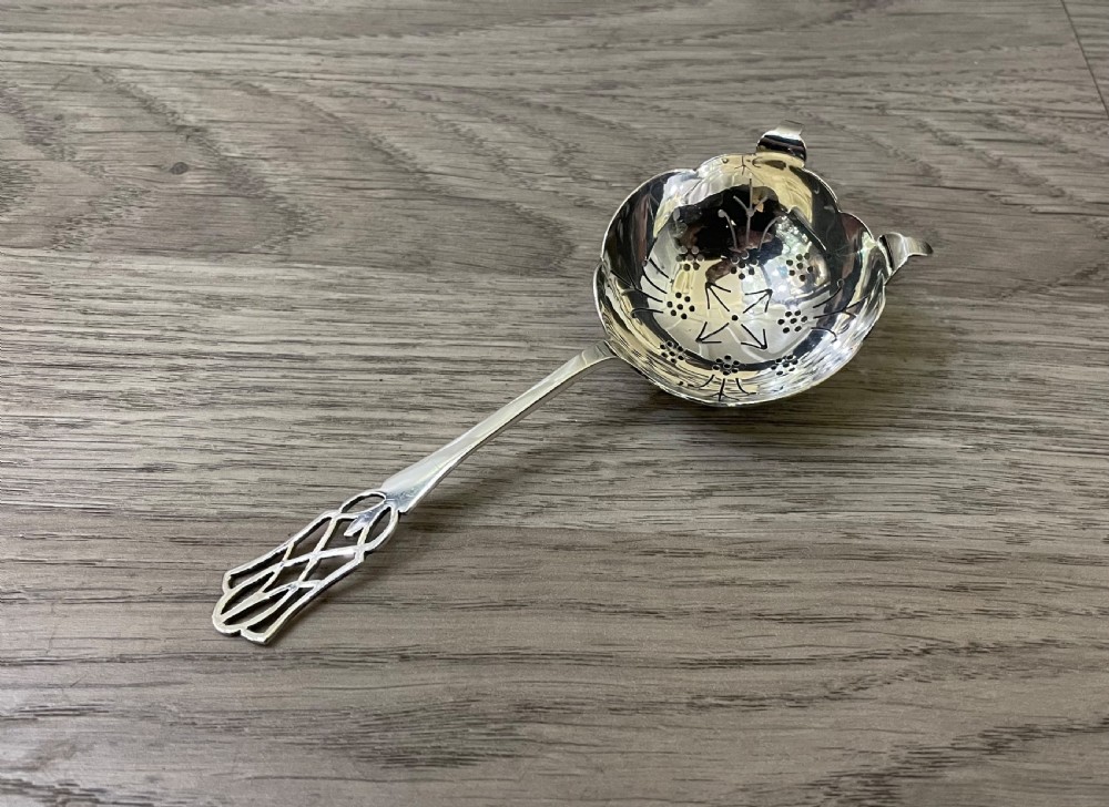 George VI solid silver tea strainer, 1939