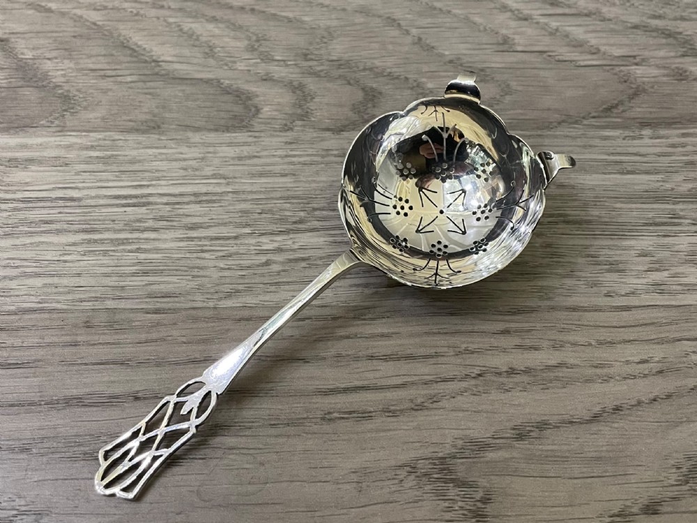 George VI solid silver tea strainer, 1939 View V