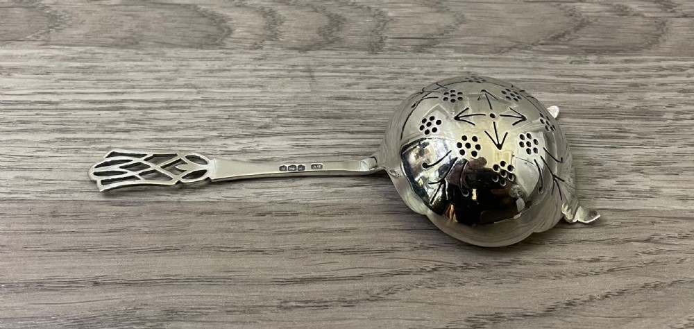 George VI solid silver tea strainer, 1939 View VI