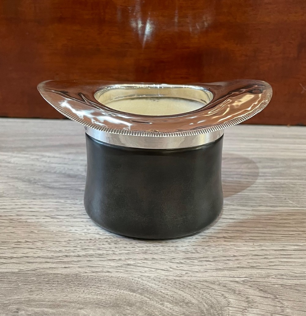 A rare Top Hat silver topped Vesta holder Striker View III