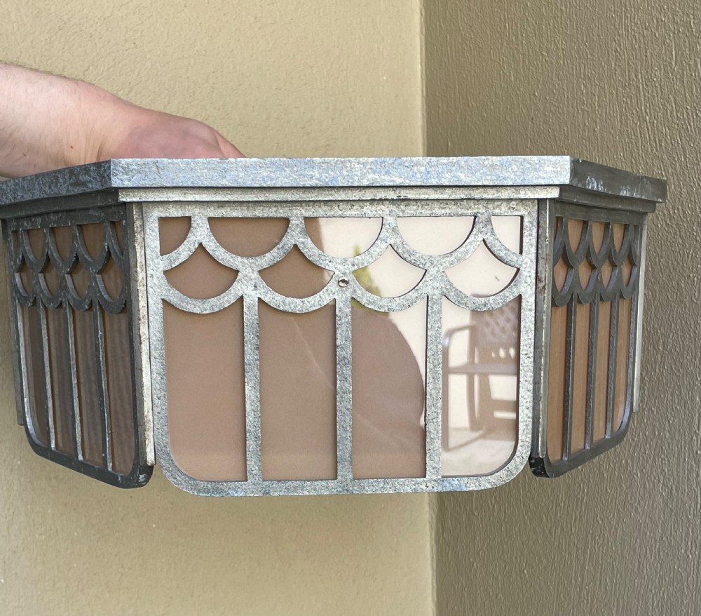An Art Deco hexagonal flush ceiling light featuring frosted amber glass panels set within a scalloped metal frame and a central glass finial. View IV