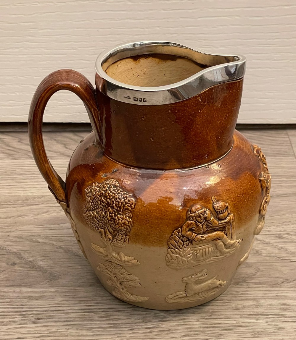 Large Doulton Lambeth Stoneware Jug with Silver Rim