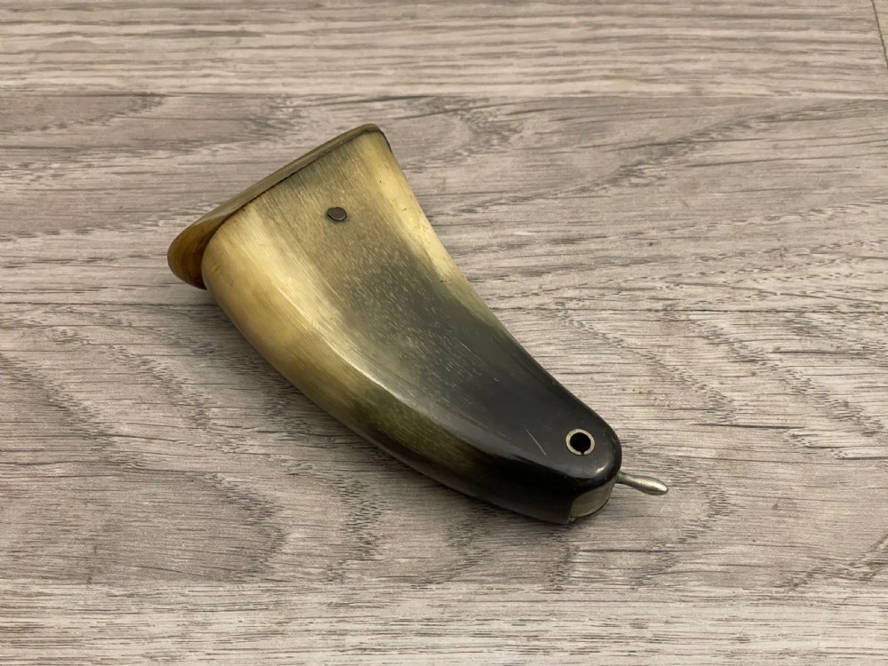 A 19th-century Scottish horn snuff mull crafted from polished natural horn with tonal variation from honey yellow to dark brown.
