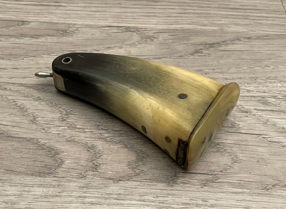 A 19th-century Scottish horn snuff mull crafted from polished natural horn with tonal variation from honey yellow to dark brown. View II