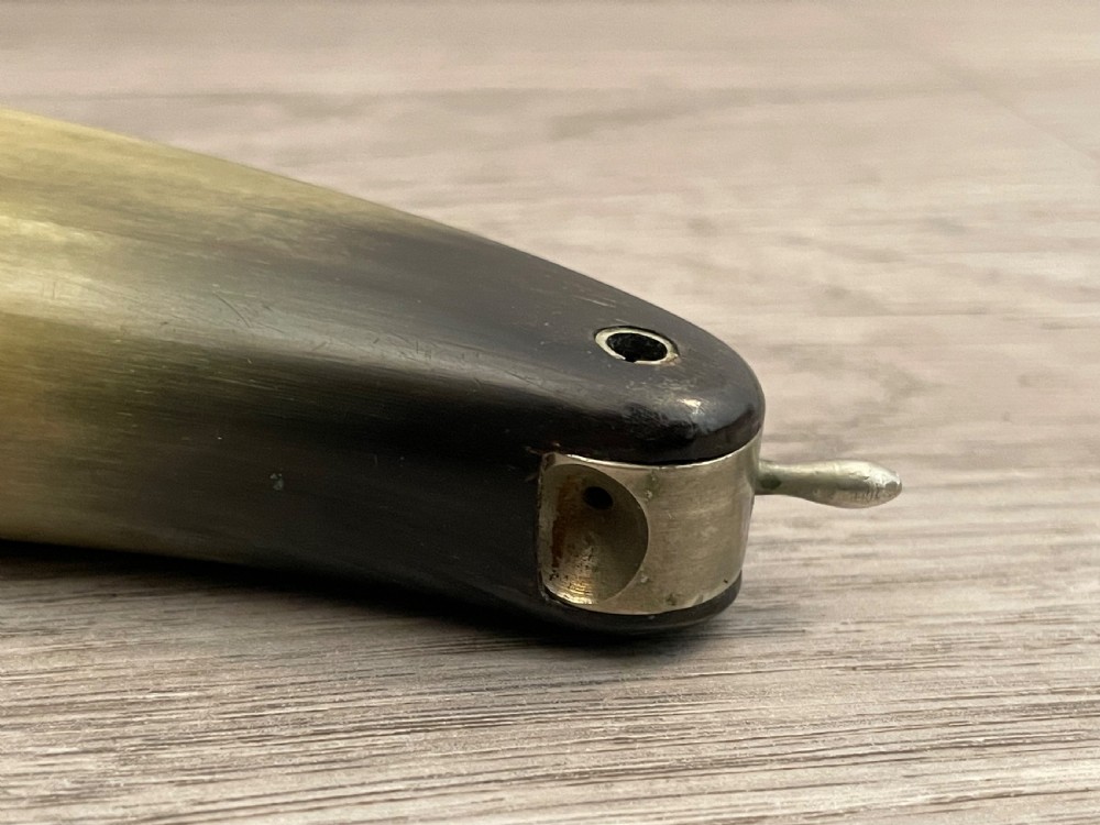 A 19th-century Scottish horn snuff mull crafted from polished natural horn with tonal variation from honey yellow to dark brown. View V
