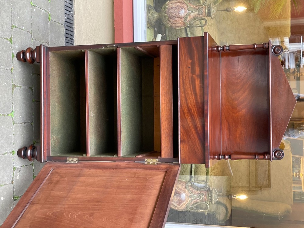 An early Victorian mahogany chiffonier sideboard featuring a top shelf with turned supports, a single frieze drawer, and a paneled cupboard door. View VI
