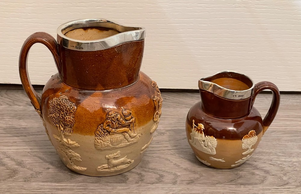 Two Victorian Doulton Lambeth Stoneware Jugs with Silver Rims View II