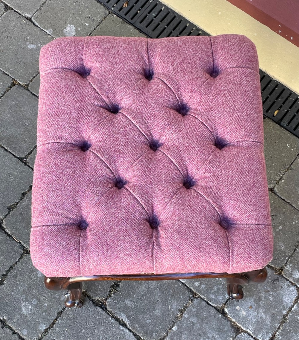 Victorian rosewood stool featuring button-tufted purple tweed upholstery, carved cabriole legs, and brass castors. View VI
