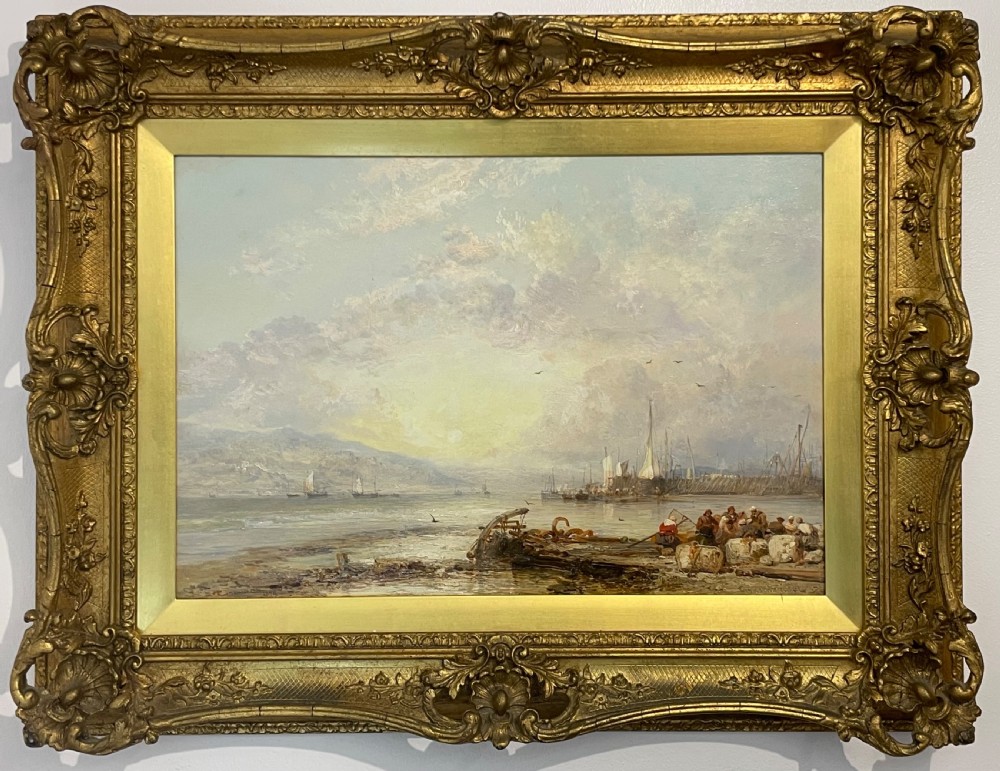 A 19th-century Victorian oil painting depicting a coastal harbour scene under a cloud-filled sky, set within an ornate gilded frame.