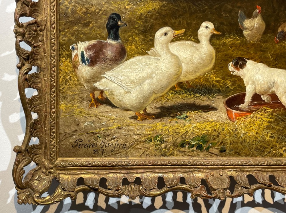 A 19th-century oil painting depicting ducks, chickens, and a small terrier inside a straw barn, enclosed in a carved gold gilt frame. View II