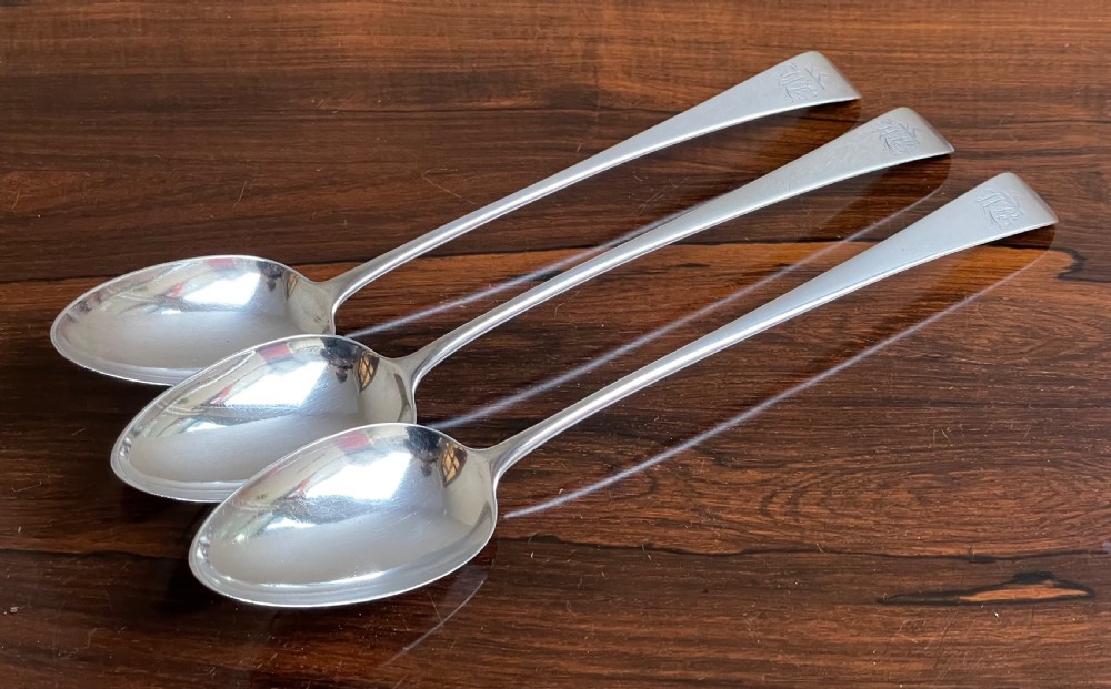 Three George III silver basting spoons