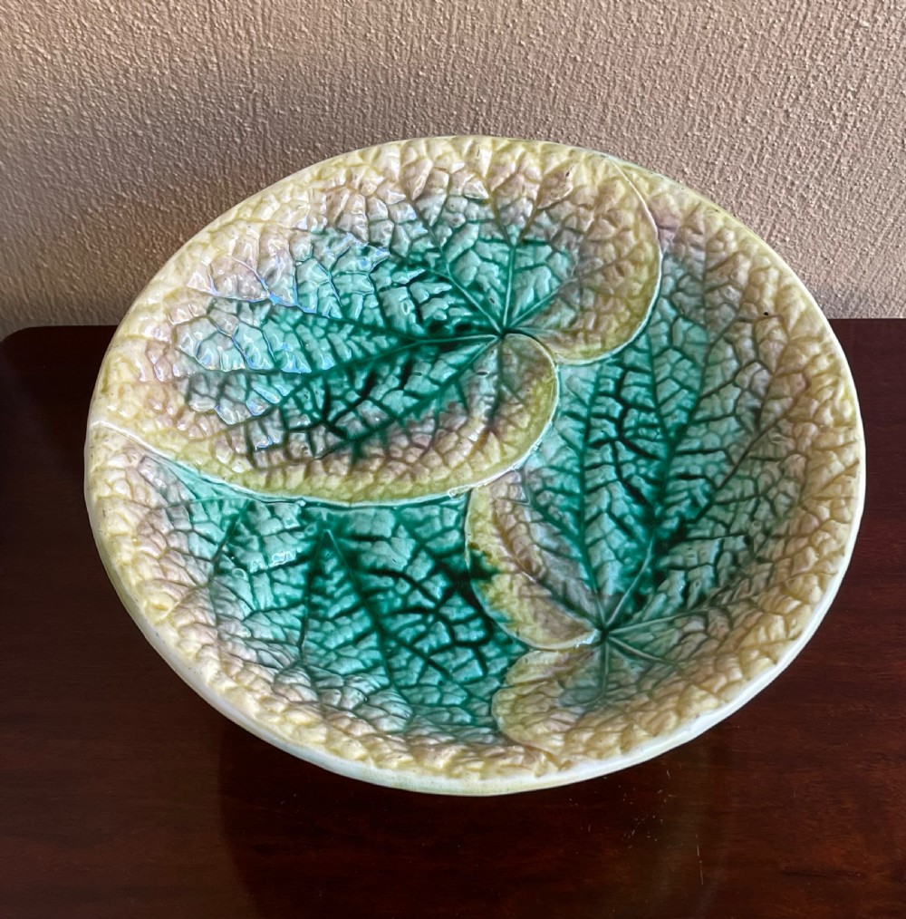 A Victorian majolica pedestal comport bowl featuring moulded green and yellow begonia leaf patterns with a matching leaf-textured stem. View II