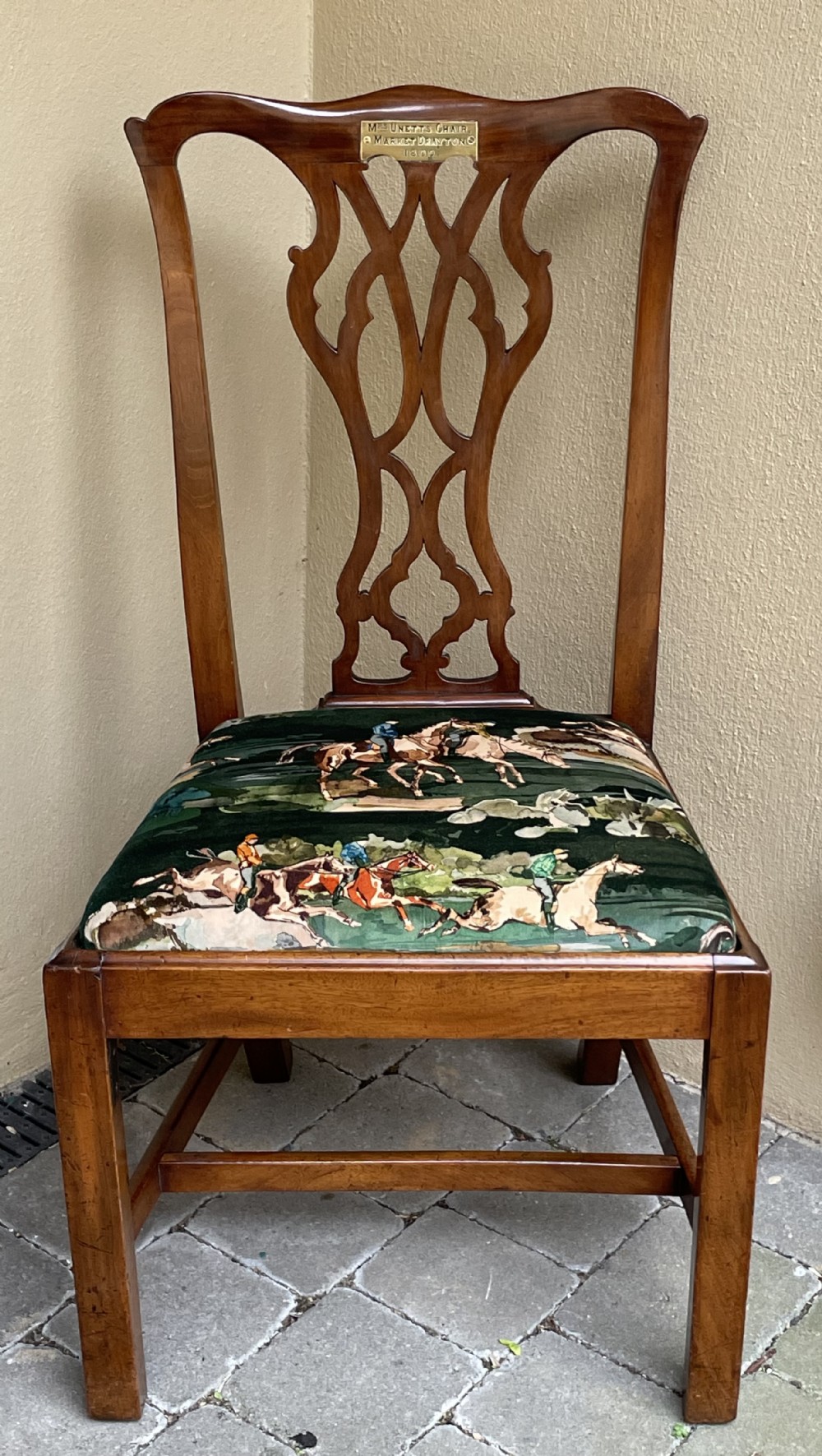 A Georgian mahogany side chair featuring a pierced back splat, an engraved brass inscription plaque on the top rail, and a printed equestrian fabric seat pad.