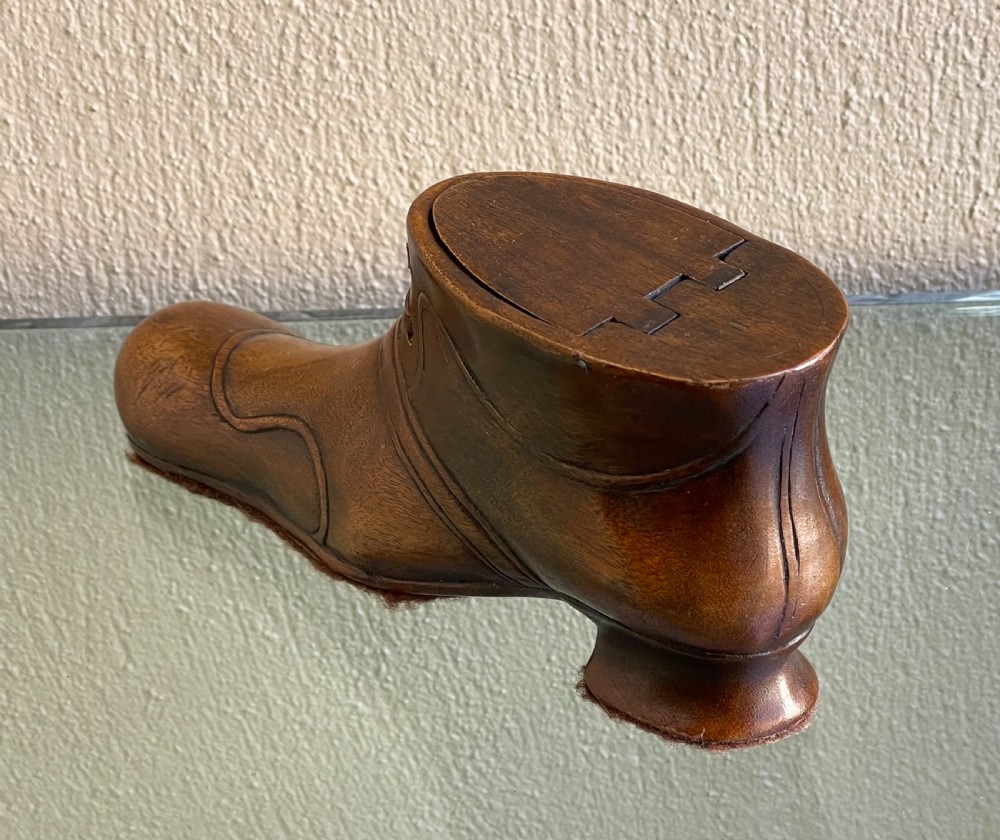 A late Victorian hand-carved wooden snuff box in the shape of a laced shoe with a sliding top lid. View III