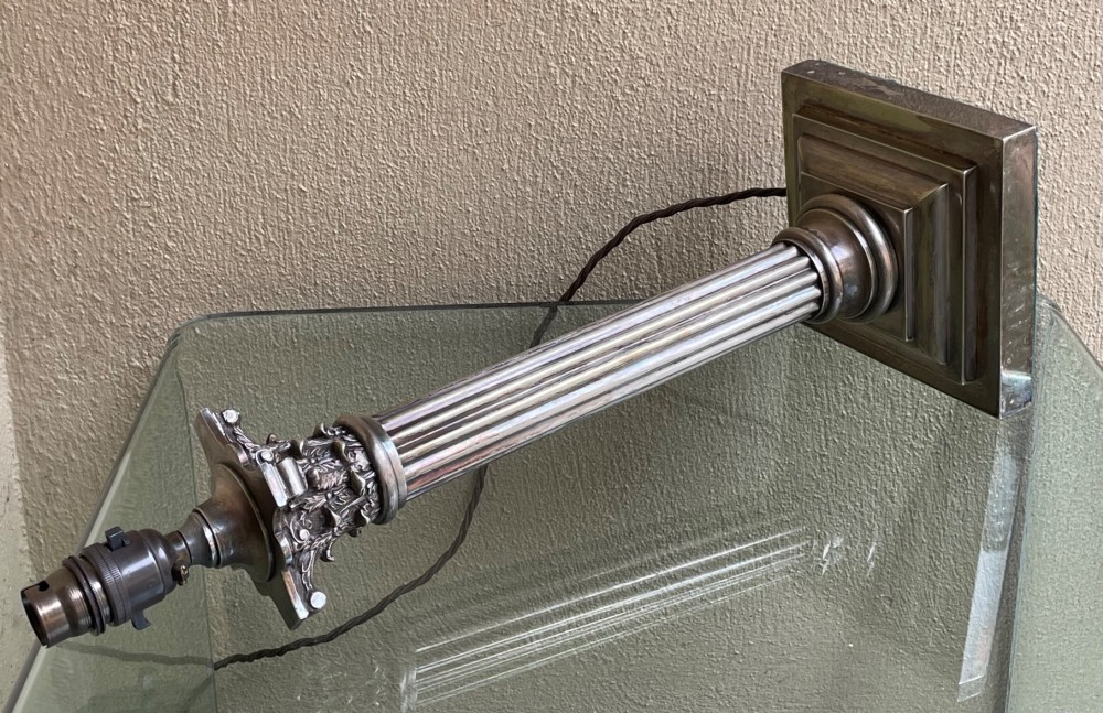 A Victorian silver-plated table lamp featuring a fluted Corinthian column on a stepped square pedestal base. View IV