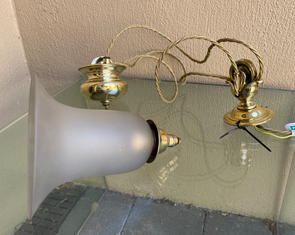 A Victorian brass rise and fall pendant light featuring a pulley mechanism, brass counterweight, twisted cord, and frosted glass shade. View II