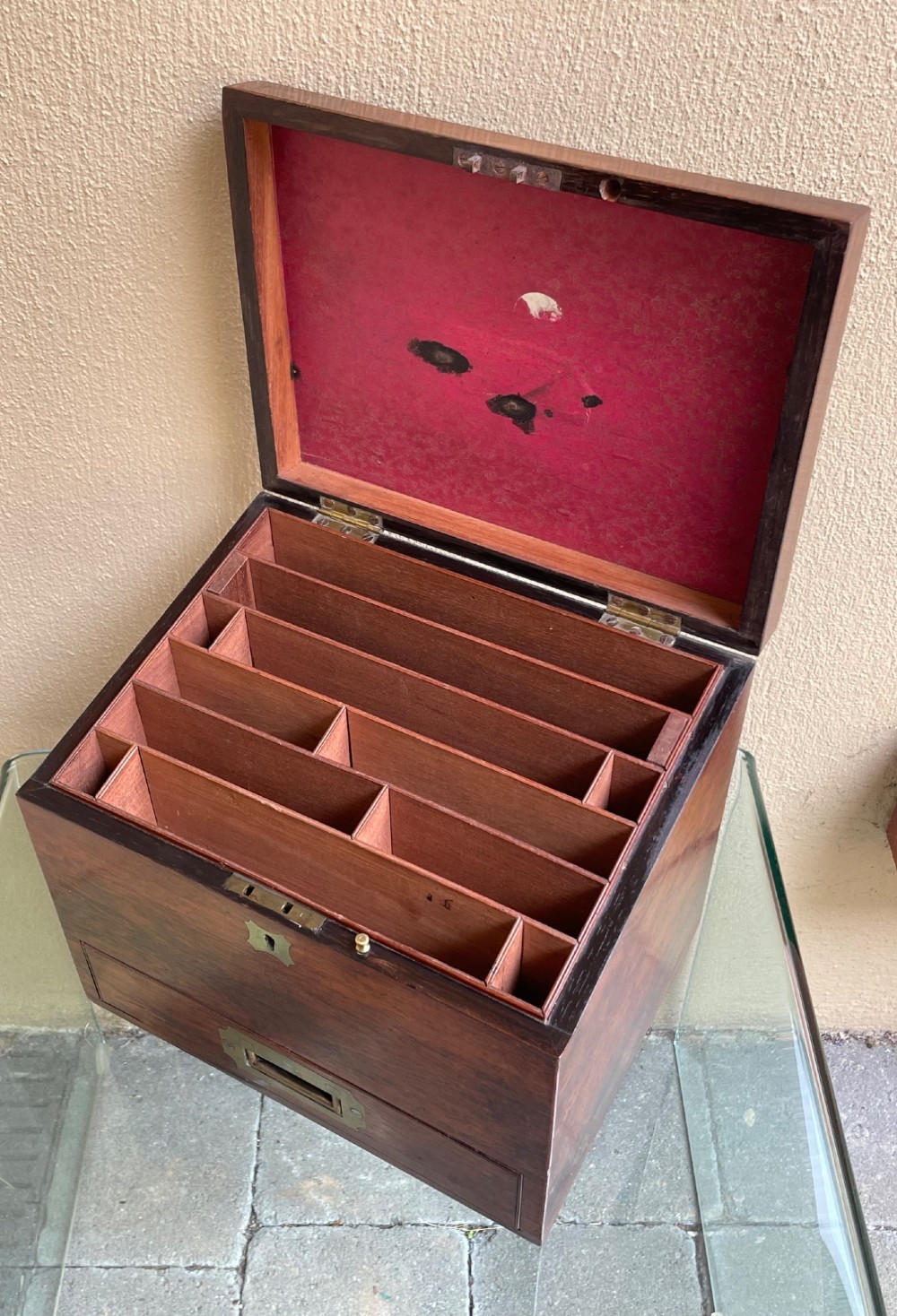 A rectangular dark wood campaign correspondence box featuring a hinged top, a brass keyhole escutcheon, and a lower drawer with a flush brass handle. View III