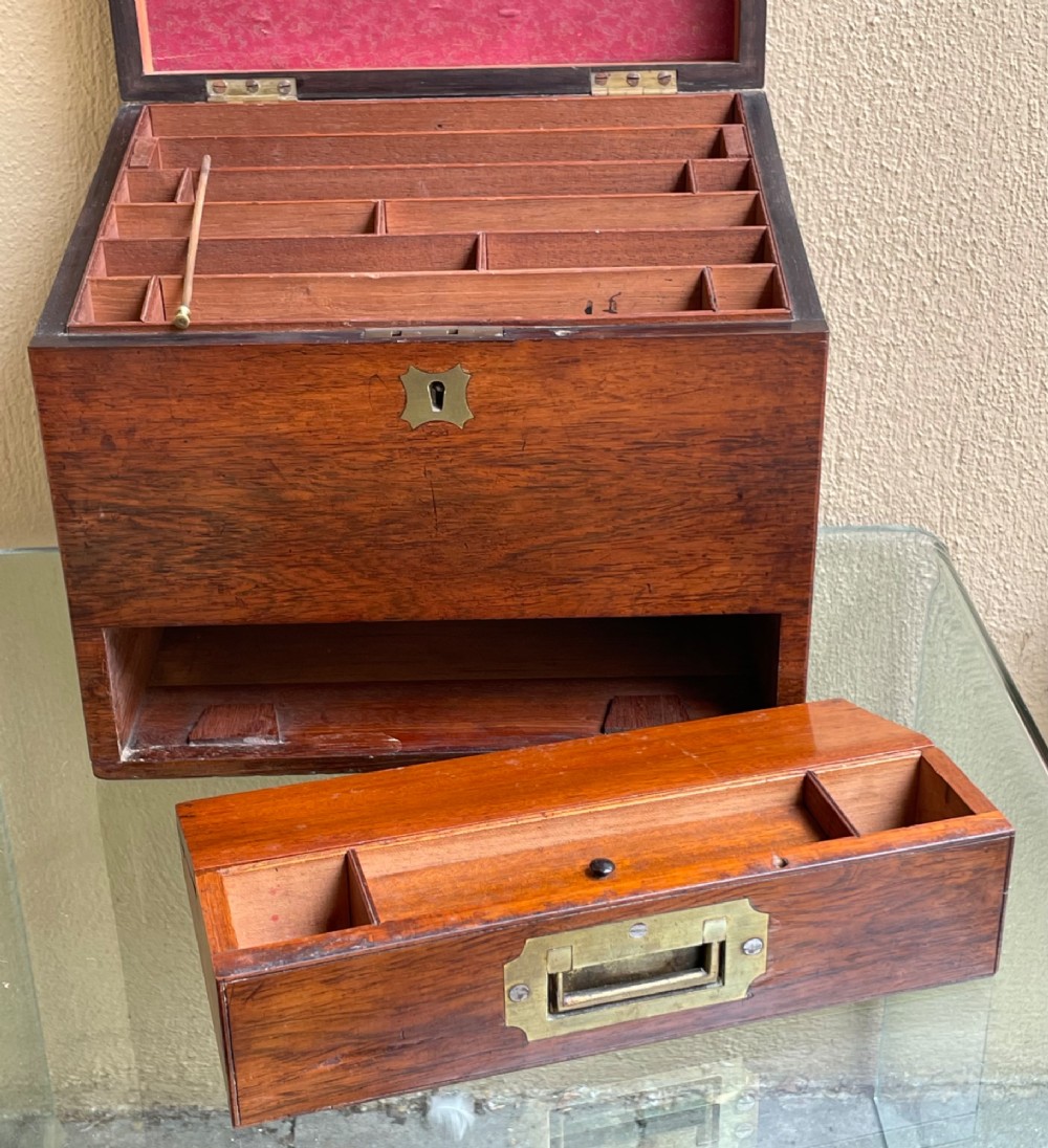 A rectangular dark wood campaign correspondence box featuring a hinged top, a brass keyhole escutcheon, and a lower drawer with a flush brass handle. View V