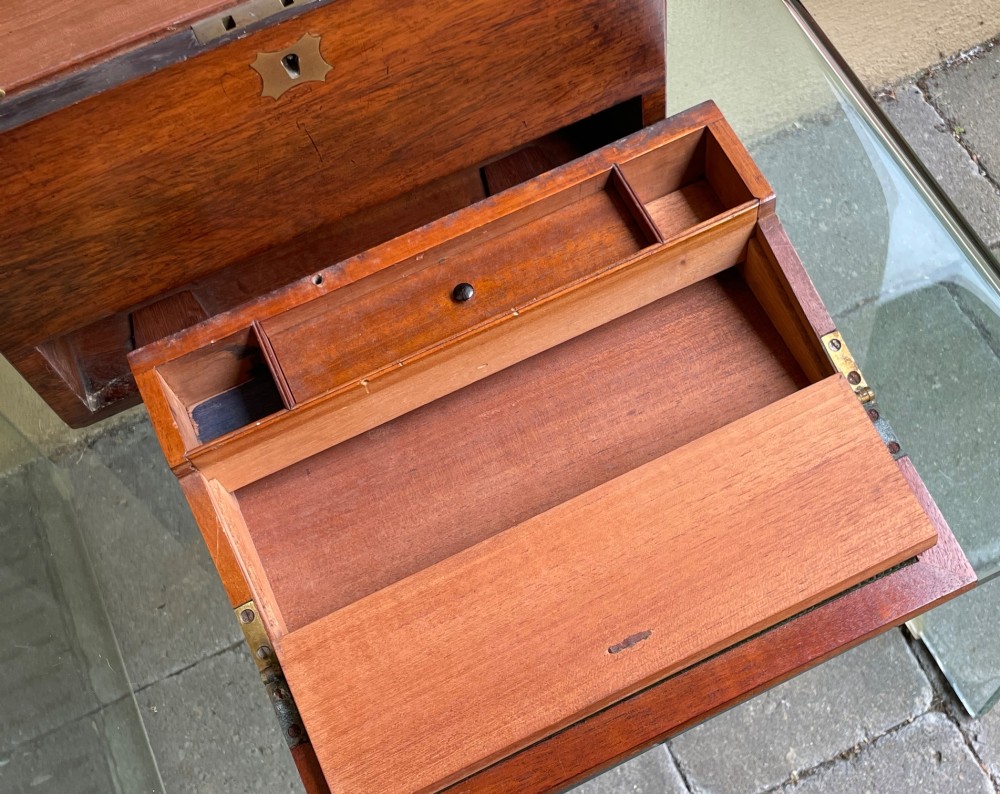 A rectangular dark wood campaign correspondence box featuring a hinged top, a brass keyhole escutcheon, and a lower drawer with a flush brass handle. View VII