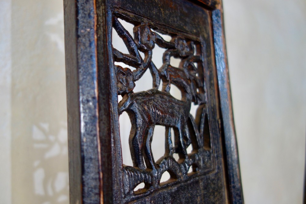 A 19th-century dark elm Chinese officials hat armchair featuring a carved yoke-back crest rail and pierced splat. View XI
