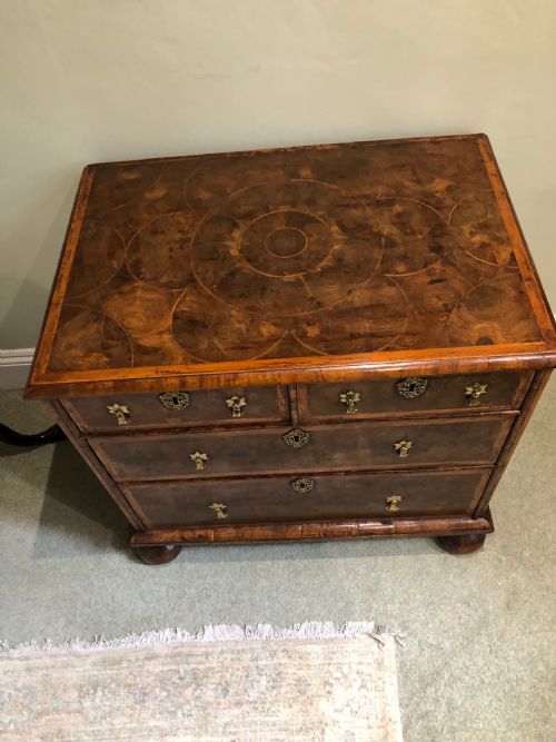 a small olive oyster chest of two long and two short drawers william and mary period - CATEGORY: ANTIQUE CHEST OF DRAWERS - DATED 17TH CENTURY