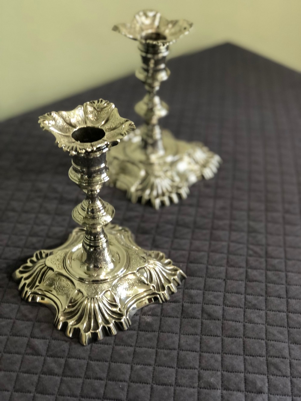 An unusual pair of Georgian silver candlestick