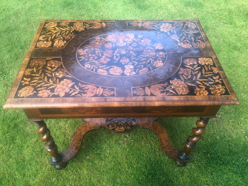 A late 17th-century William and Mary walnut side table featuring elaborate floral marquetry inlays on the rectangular top, spiral-turned legs, and a shaped X-stretcher. View II