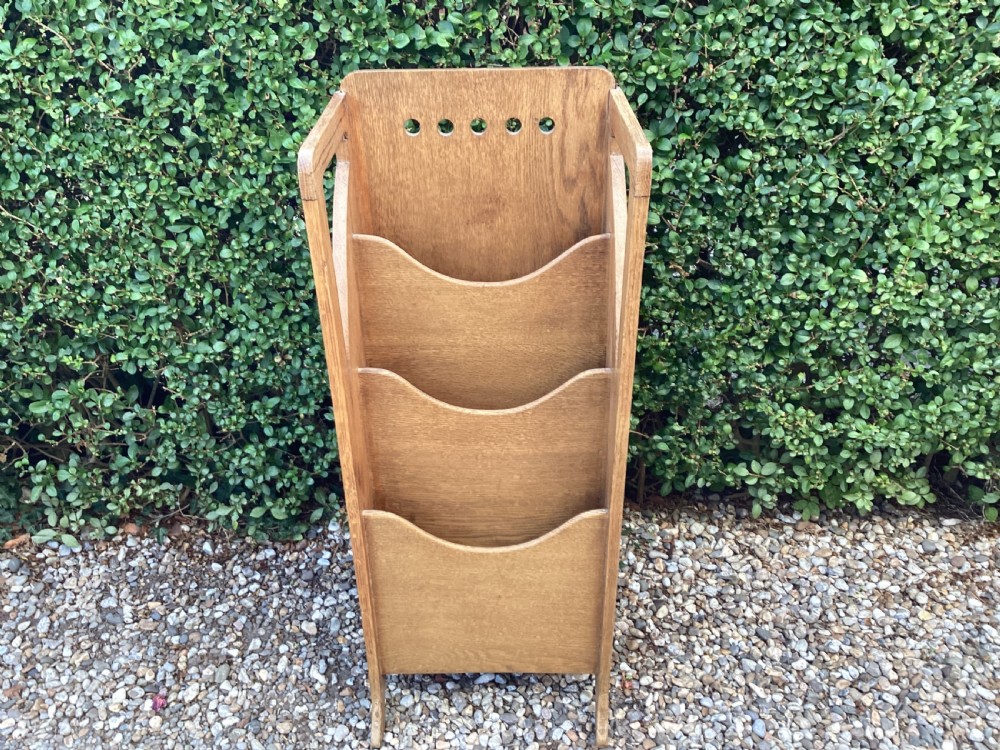 An Arts and Crafts oak magazine paper rack