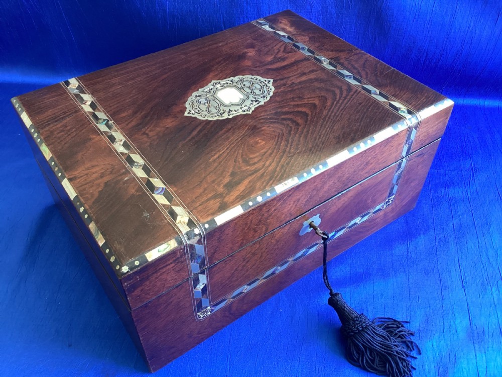 A dark rosewood rectangular writing slope featuring mother-of-pearl and abalone shell geometric inlaid borders and a central decorated cartouche. View II