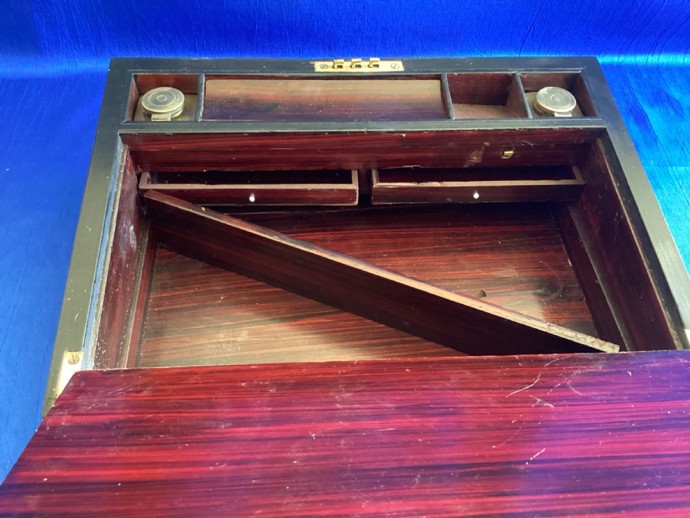A dark rosewood rectangular writing slope featuring mother-of-pearl and abalone shell geometric inlaid borders and a central decorated cartouche. View IV