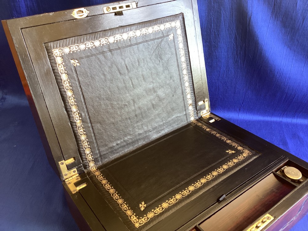 A dark rosewood rectangular writing slope featuring mother-of-pearl and abalone shell geometric inlaid borders and a central decorated cartouche. View VIII