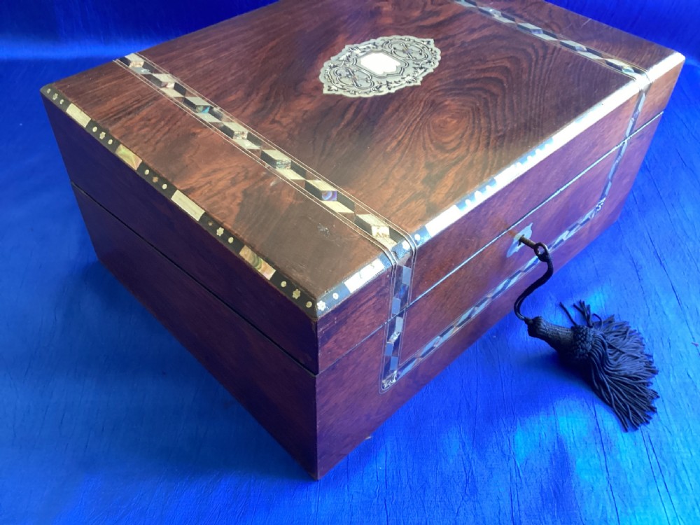 A dark rosewood rectangular writing slope featuring mother-of-pearl and abalone shell geometric inlaid borders and a central decorated cartouche. View XII