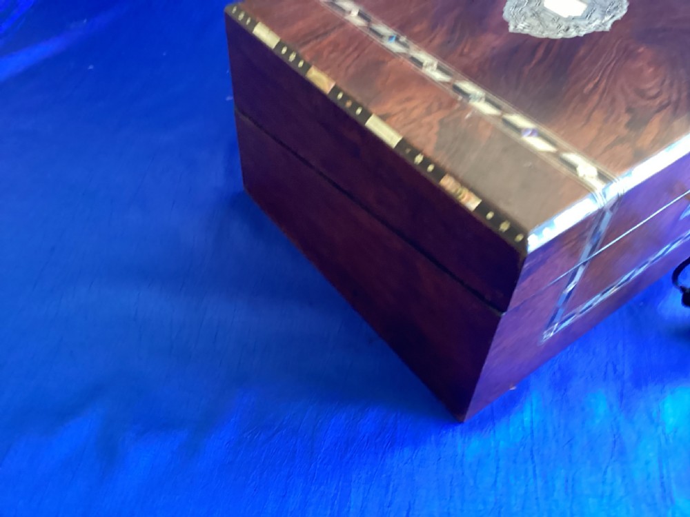 A dark rosewood rectangular writing slope featuring mother-of-pearl and abalone shell geometric inlaid borders and a central decorated cartouche. View XIII