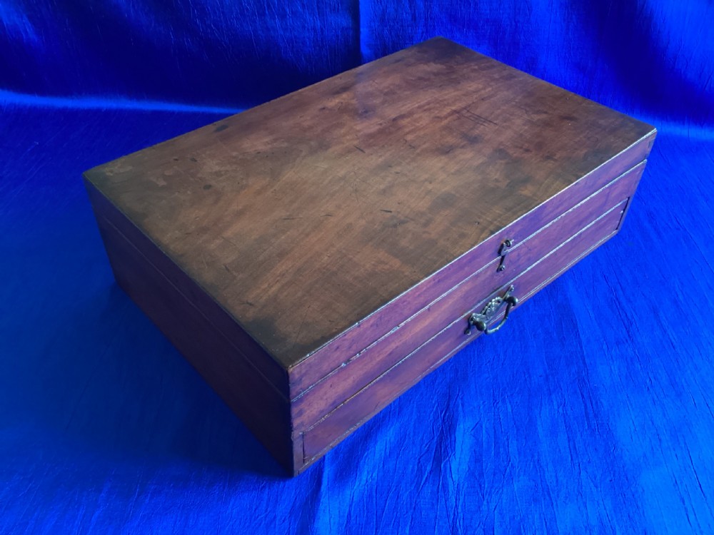 A rectangular Edwardian mahogany artist box featuring a hinged top lid, a lower pull-out drawer with a brass handle, and a brass hook latch on the front. View II