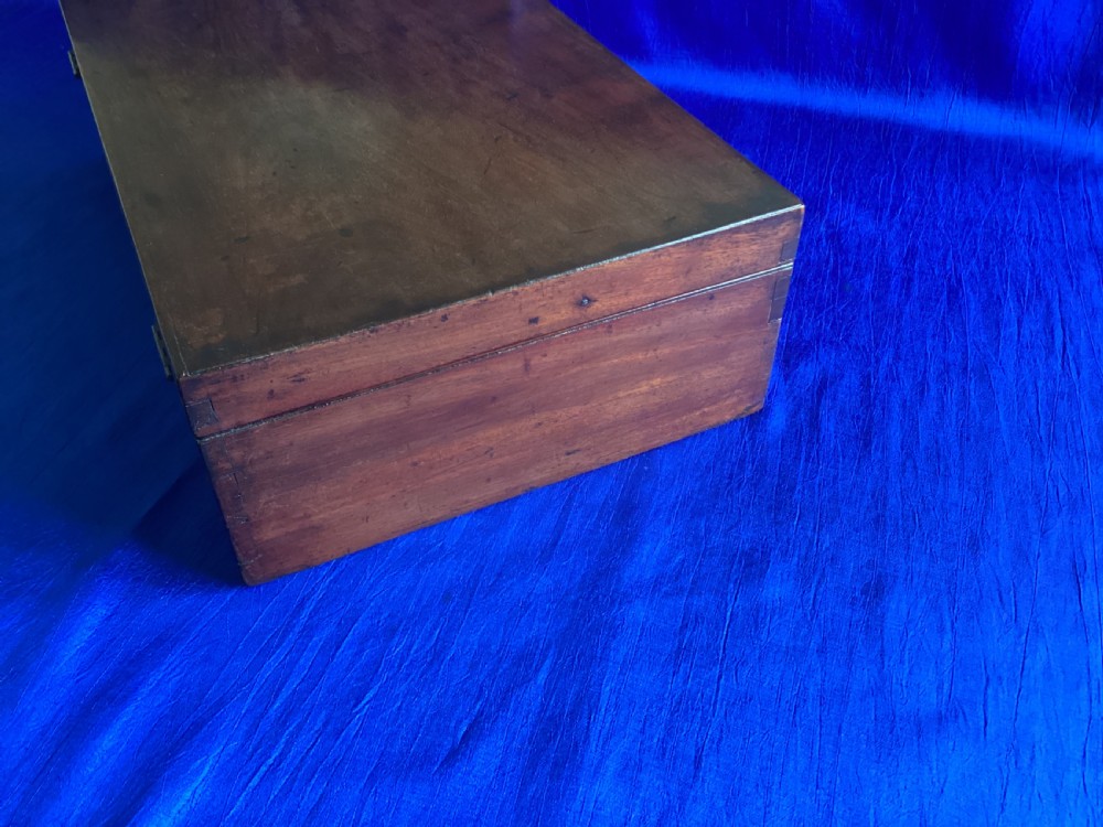 A rectangular Edwardian mahogany artist box featuring a hinged top lid, a lower pull-out drawer with a brass handle, and a brass hook latch on the front. View III