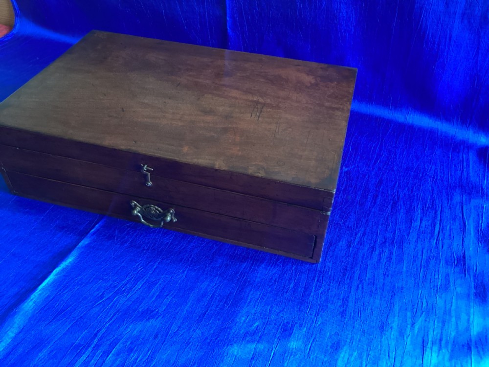 A rectangular Edwardian mahogany artist box featuring a hinged top lid, a lower pull-out drawer with a brass handle, and a brass hook latch on the front. View VIII