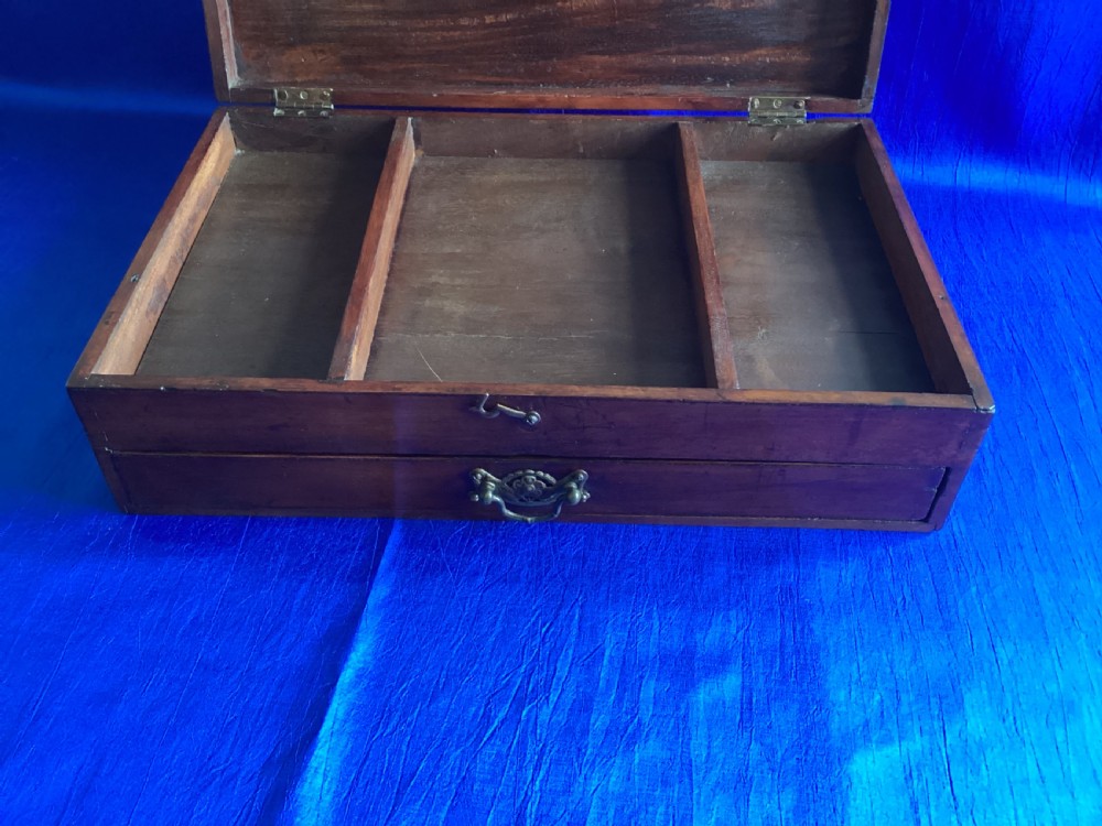 A rectangular Edwardian mahogany artist box featuring a hinged top lid, a lower pull-out drawer with a brass handle, and a brass hook latch on the front. View X