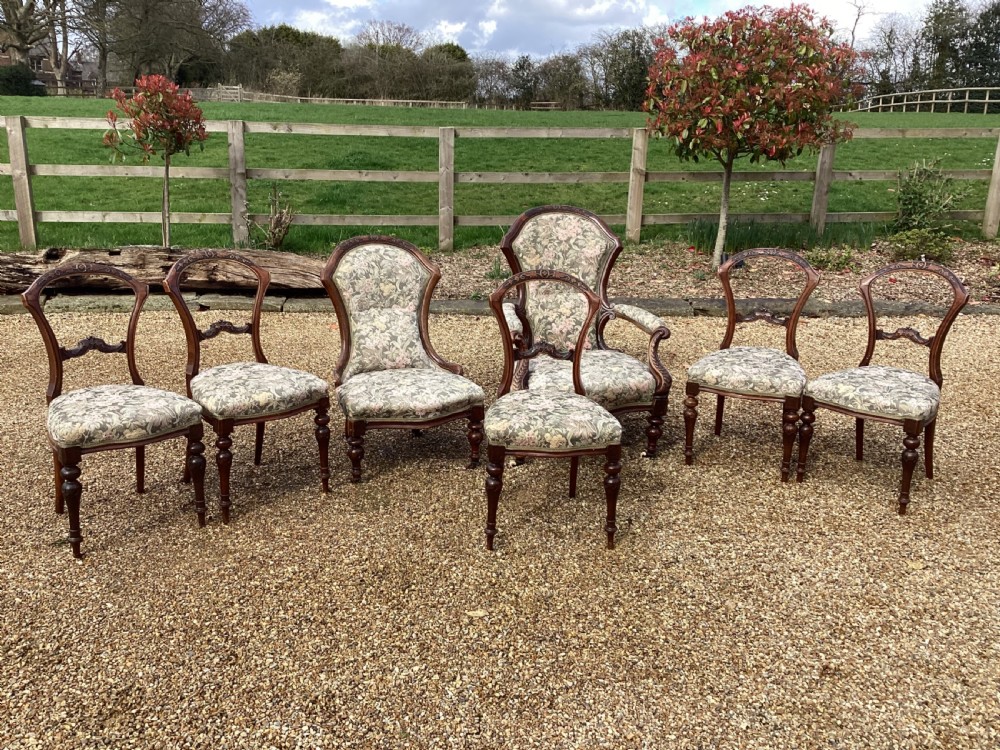 A Victorian walnut parlour suite